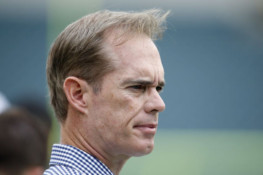 Sportscaster Joe Buck watches pre-game warmups before an NFL football game between the Philadelphia Eagles and the Washington Redskins, Sunday, Sept. 21, 2014, in Philadelphia. (AP Photo/Michael Perez)