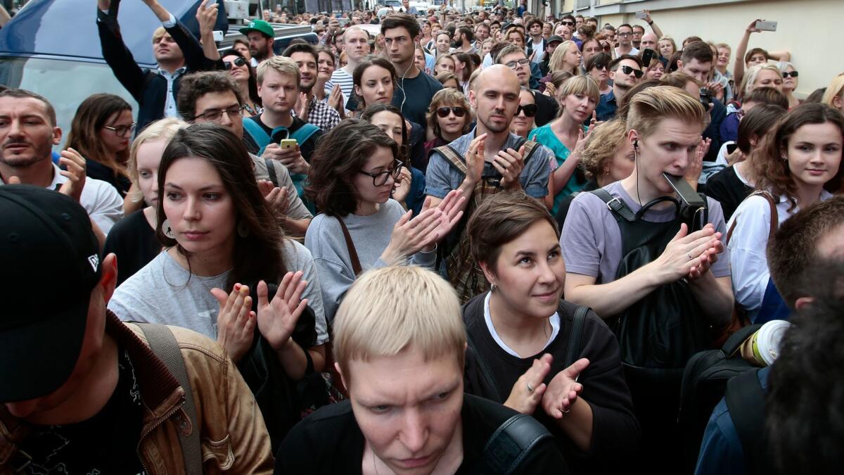 Supporters of director Kirill Serebrennikov gather in front of a Moscow courthouse where he was placed under house arrest on Wednesday.