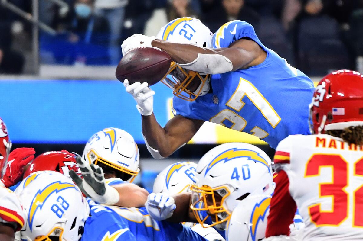 Chiefs defensive tackle Tershawn Wharton knocks the ball loose from Chargers running back Joshua Kelley near the goal line. 