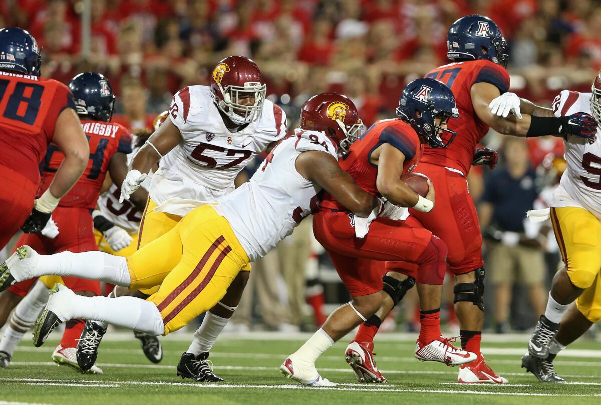 USC defensive end Leonard Williams takes down Arizona quarterback Anu Solomon in Tucson on Oct. 11.
