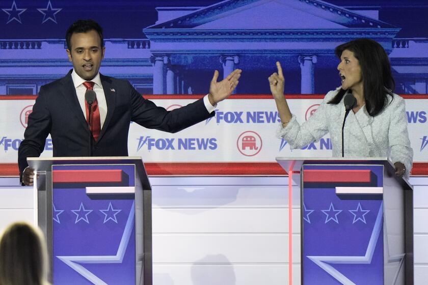 Businessman Vivek Ramaswamy and former U.N. Ambassador Nikki Haley speak during a Republican presidential primary debate hosted by FOX News Channel Wednesday, Aug. 23, 2023, in Milwaukee. (AP Photo/Morry Gash)