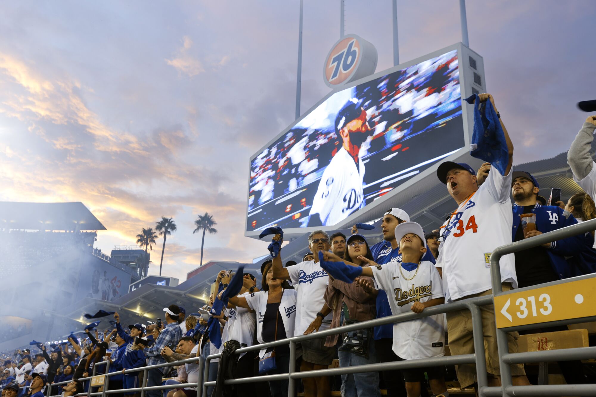 The fans cheer from the outfield as Dodgers Cody Bellinger is introduced.