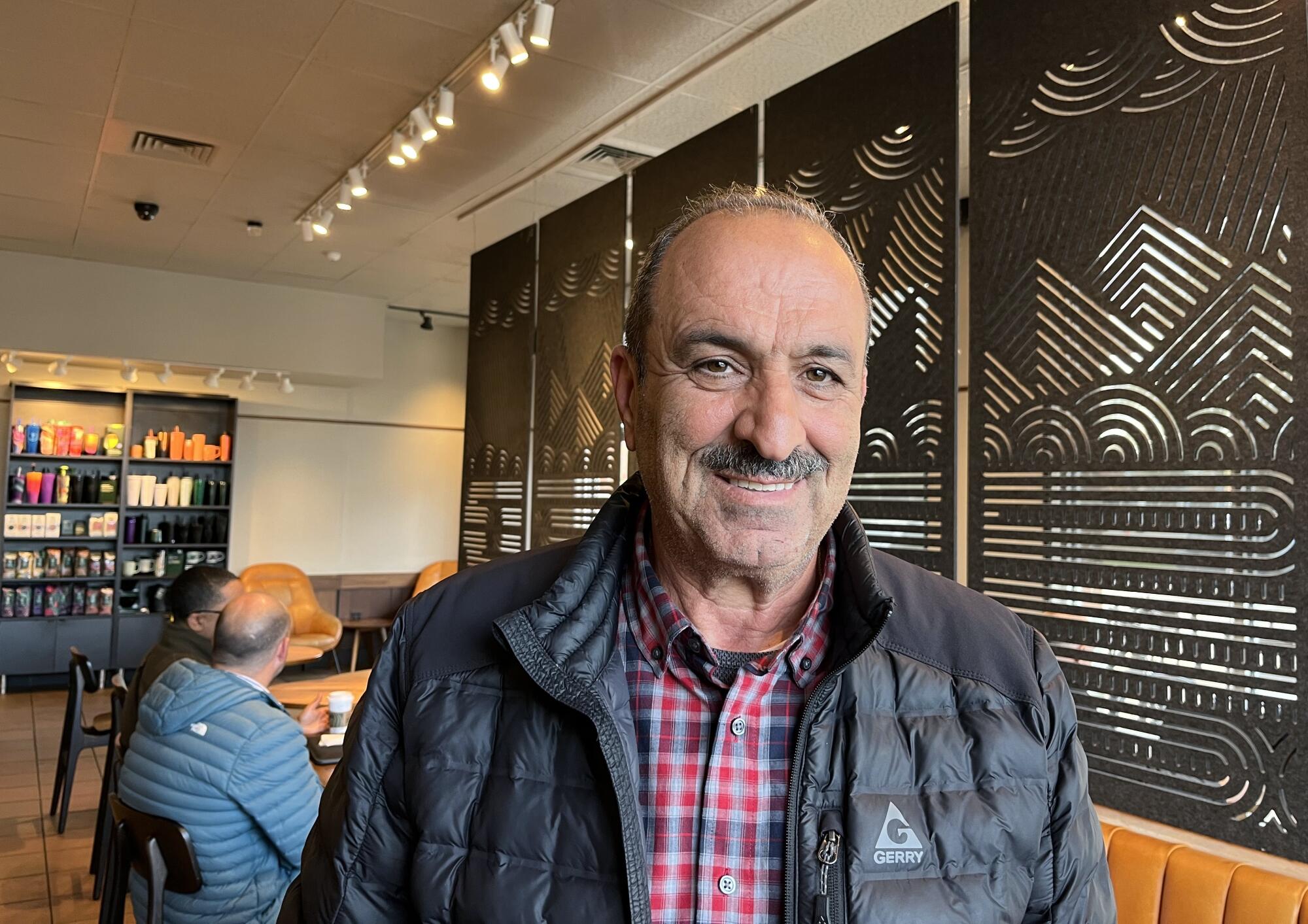 Amgad Fram remains undecided in the last three weeks of the campaign but is leaning 60-40 toward voting for Trump.