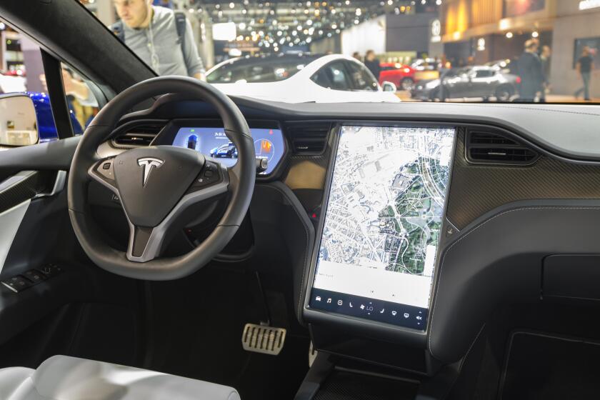BRUSSELS, BELGIUM - JANUARY 9: Interior on a Tesla Model X full electric luxury crossover SUV car with a large touch screen and carbon look dashboard on display at Brussels Expo on January 9, 2020 in Brussels, Belgium. The Model X uses falcon wing doors for access to the second and third row seats. (Photo by Sjoerd van der Wal/Getty Images)