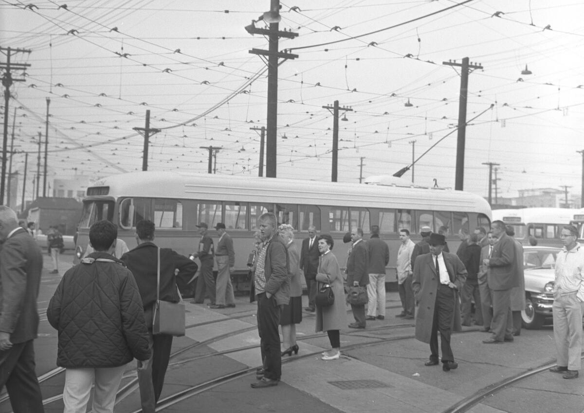 People stand by a streetcar
