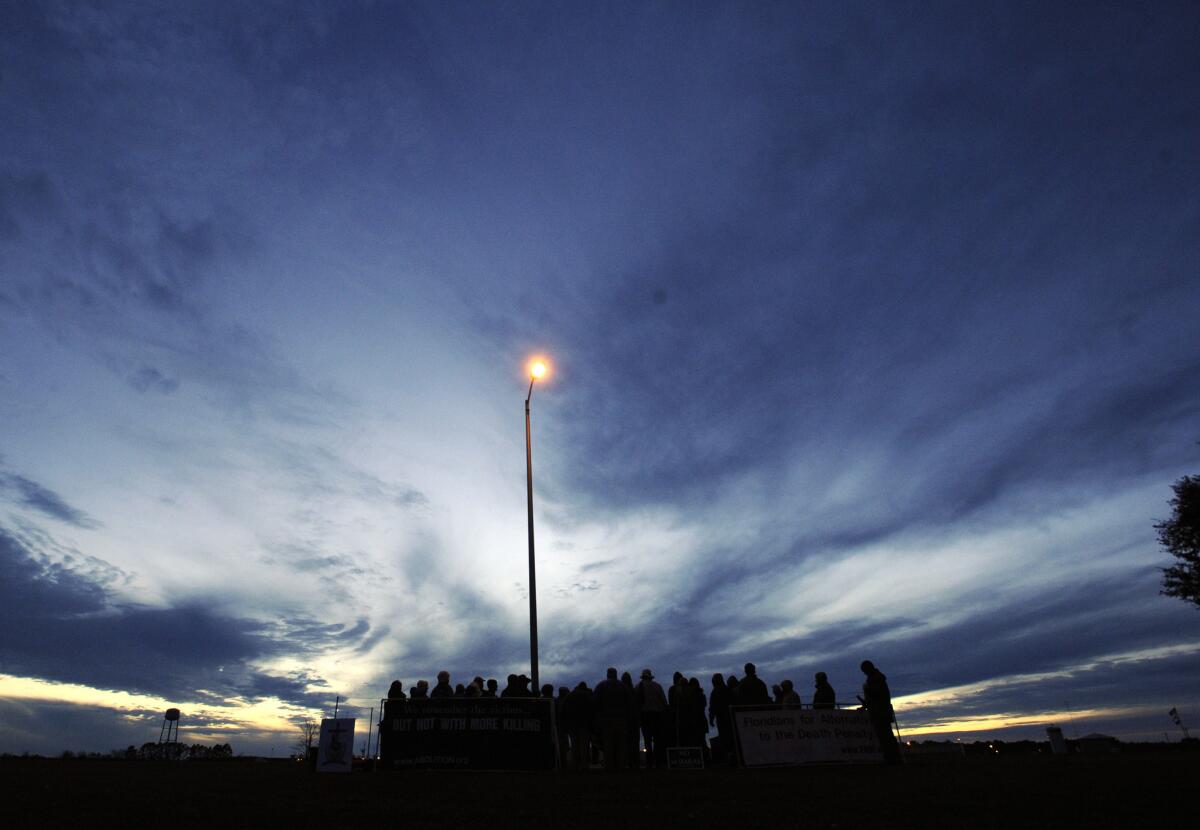 Protesters against the death penalty demonstrate in front of the Florida State Prison.