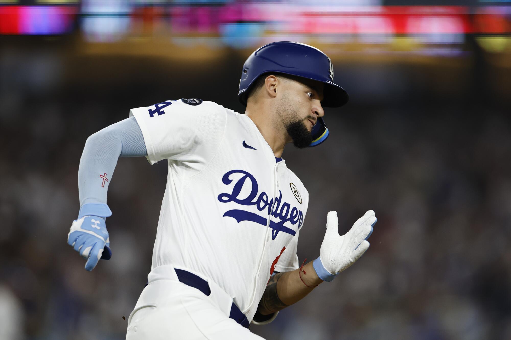 Dodgers outfielder Andy Pages hits a double against the Phillies in the NLCS on Sept. 15.