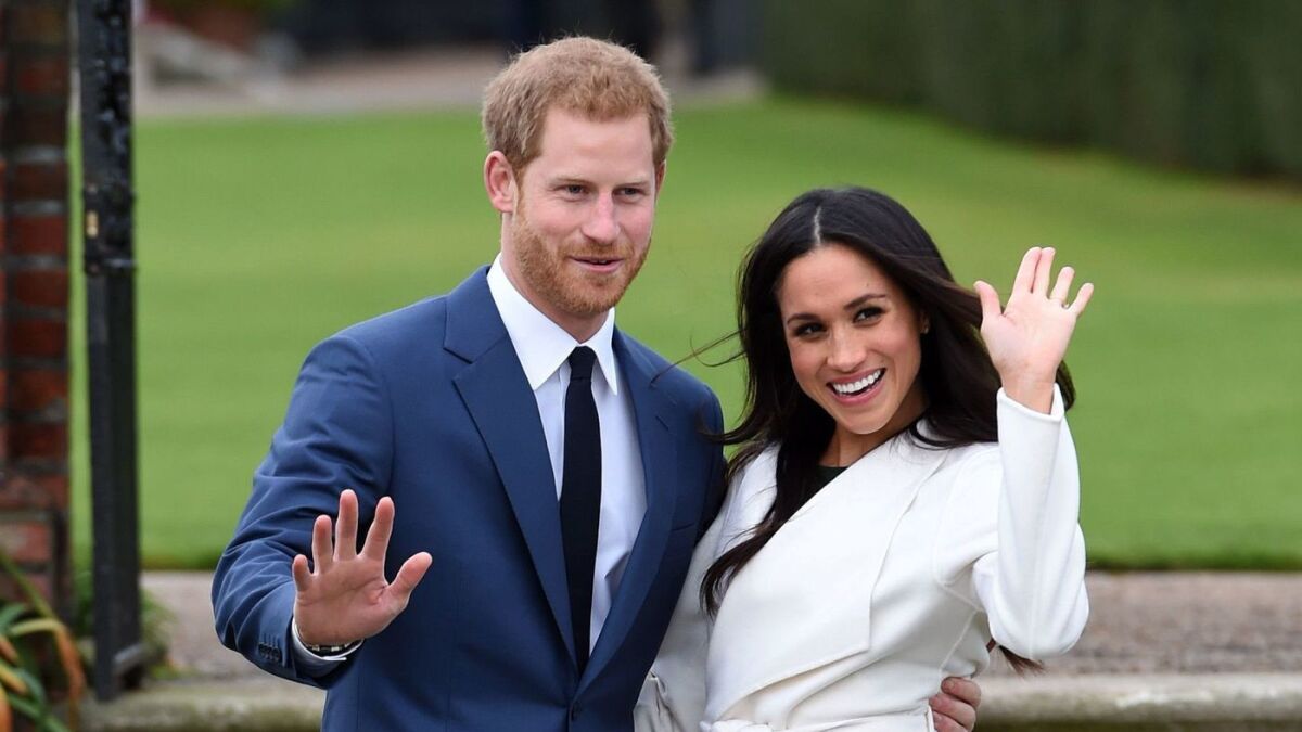 Britain's Prince Harry and Meghan Markle pose Nov. 27 for the media on the grounds of Kensington Palace.