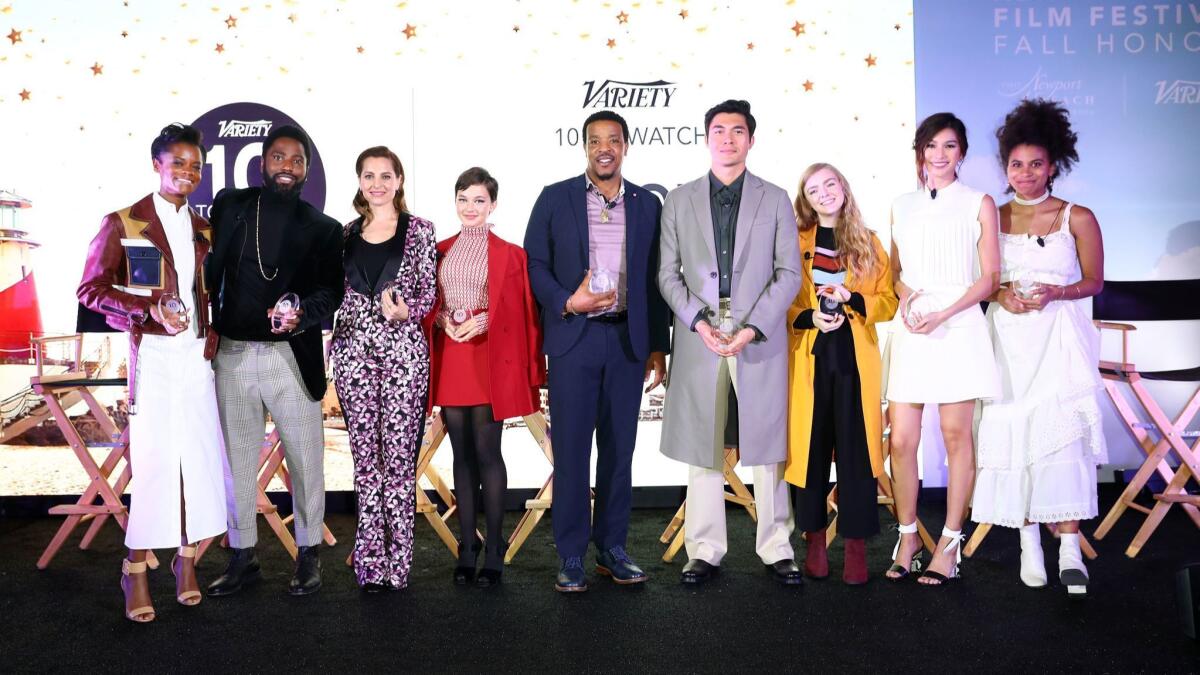 Letitia Wright, John David Washington, Marina De Tavira, Cailee Spaeny, Russell Hornsby, Henry Golding, Elsie Fisher, Gemma Chan and Zazie Beetz (from left) pose for a group photo onstage at the Newport Beach Film Festival Fall Honors and Variety’s 10 Actors To Watch.