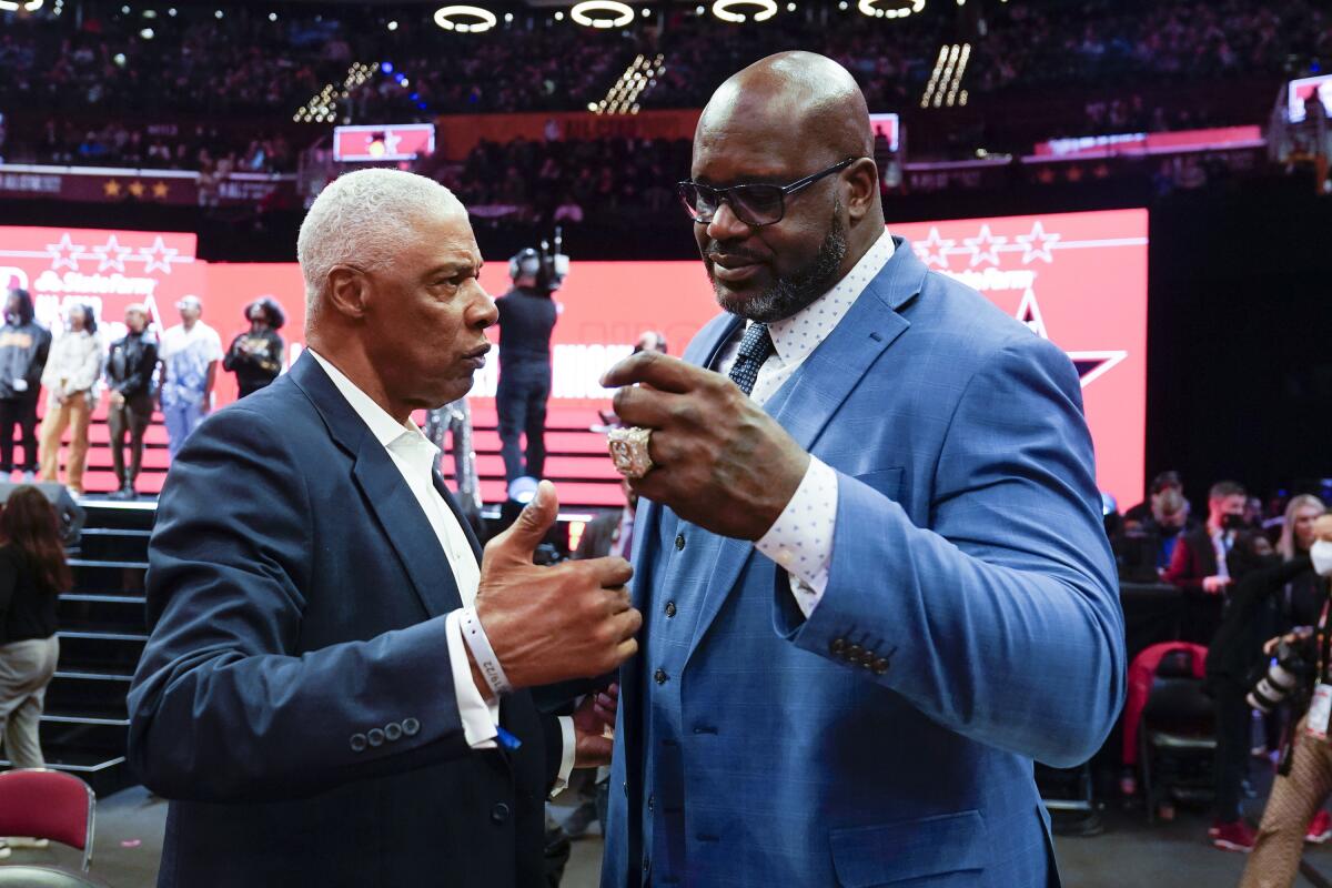 Shaquille O'Neal greets Julius Erving at Rocket Mortage FieldHouse during the Skills Challenge at NBA All-Star Weekend.