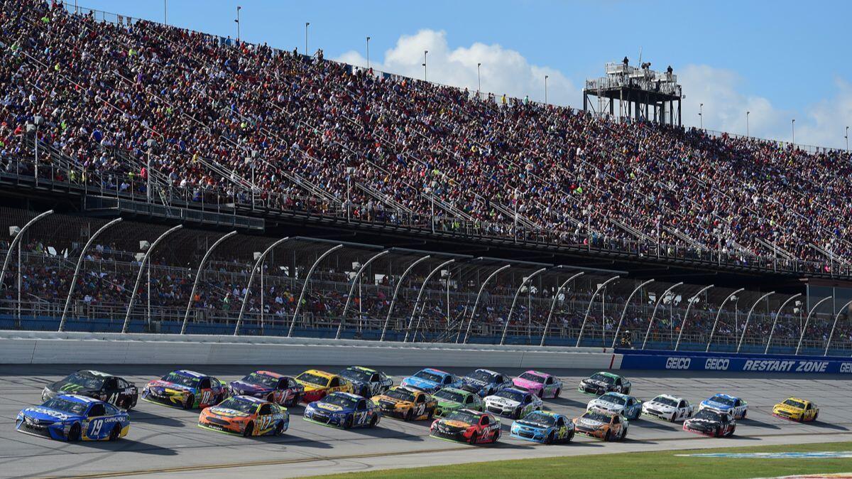 Daniel Suarez (19) leads a pack of cars during the Monster Energy NASCAR Cup Series Alabama 500 at Talladega Superspeedway on Sunday.