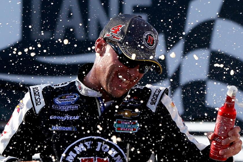 Kevin Harvick celebrates after winning the Jimmy John's Freaky Fast 300 at Chicagoland Speedway on Saturday. Harvick has won four Nationwide Series races this season.