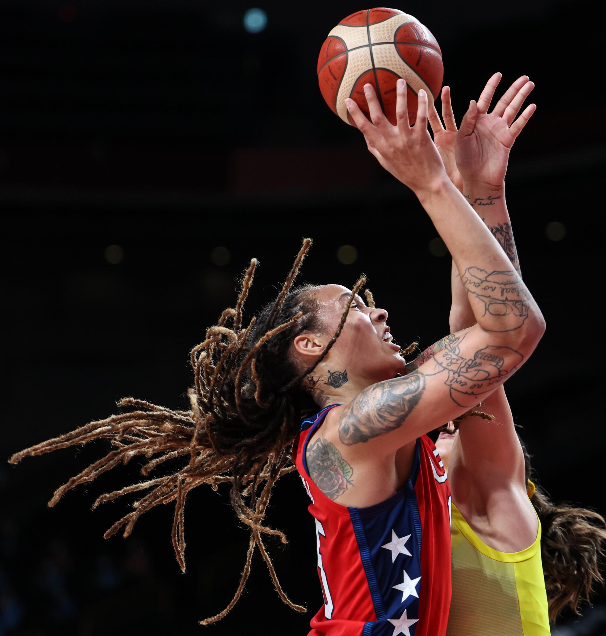 Brittney Griner shoots over Marianna Tolo during women's basketball at the Tokyo Olympics.