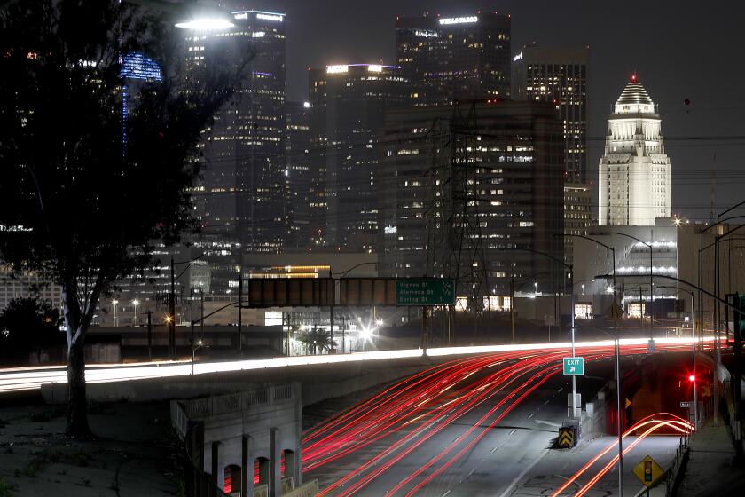 LOS ANGELES, CALIF. - APR. 1, 2020. Motor traffic is light in the interchange of Highway 101 and Interstate 10 in downtown Los Angeles as much of California remains in coronavirus lockdown on Apr. 1, 2020. (Luis Sinco/Los Angeles Times)