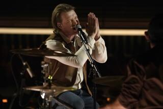 Morgan Wallen performs at the Billboard Music Awards on Sunday, May 15, 2022, at the MGM Grand Garden Arena in Las Vegas. (AP Photo/Chris Pizzello)