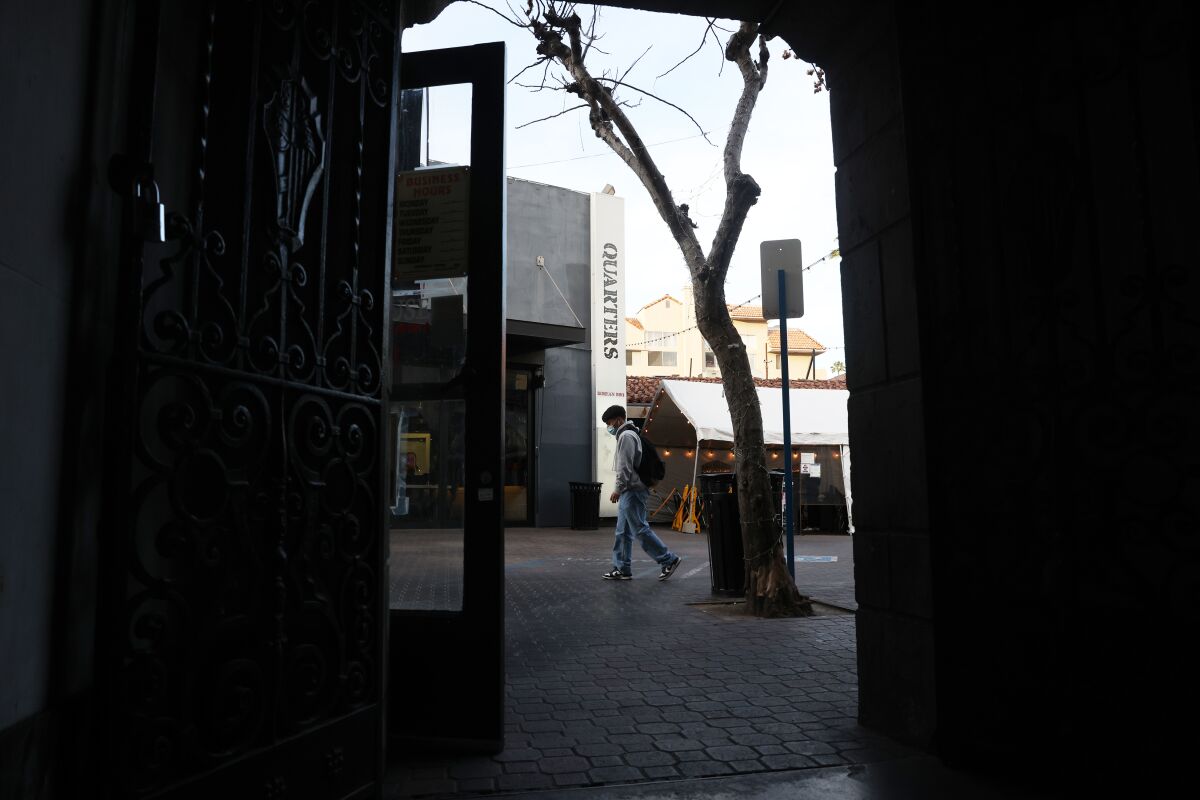 A person walks past Quarters restaurant