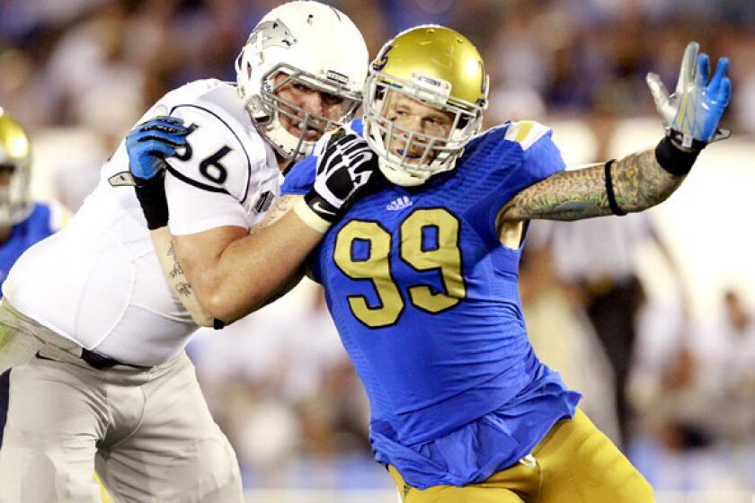 UCLA defensive end Cassius Marsh works to beat the block of Nevada offensive tackle Kyle Roberts during a game earlier this season.
