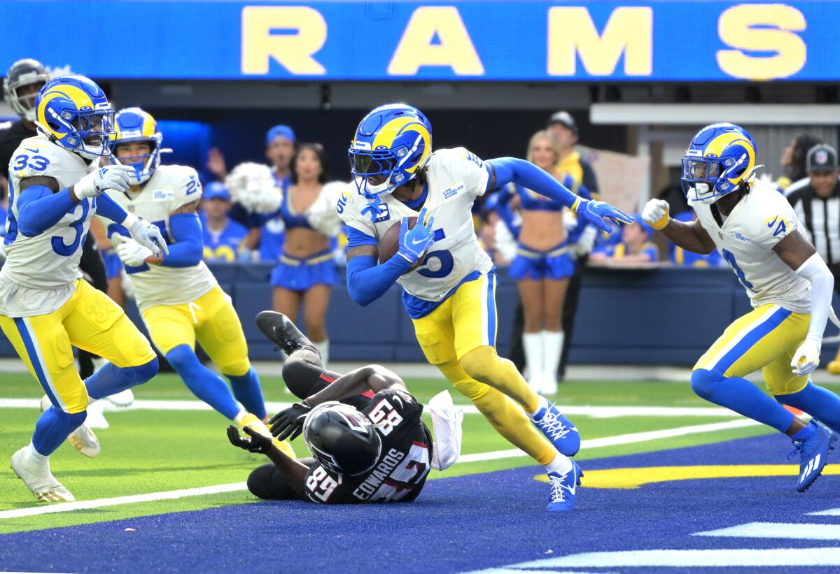Rams defensive back Jalen Ramsey returns an interception against the Atlanta Falcons.