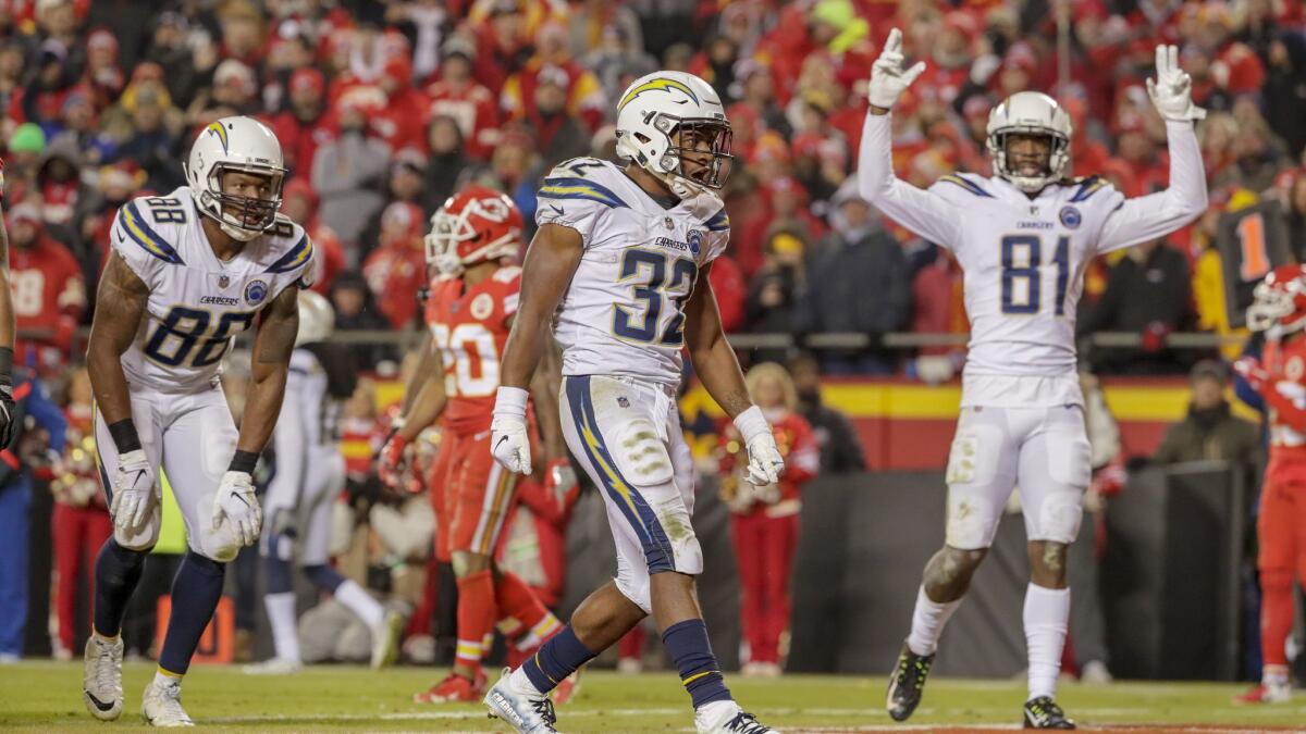 Chargers running back Justin Jackson celebrates after scoring a thee-yard touchdown run in the fourth quarter at Arrowhead Stadium.