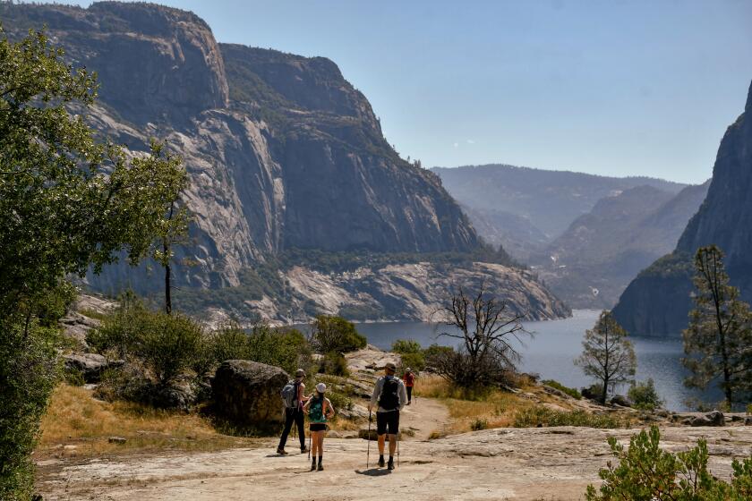 A 5-mile trail (round-trip) leads from the Hetch Hetchy Valley's O'Shaughnessy Dam to Wapama Falls in Yosemite National Park. The route skirts the edge of the Hetchy Hetchy Reservoir.