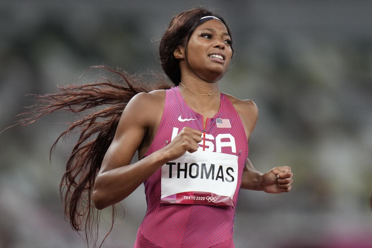 U.S. sprinter Gabrielle Thomas slows down after running a 200-meter semifinal.