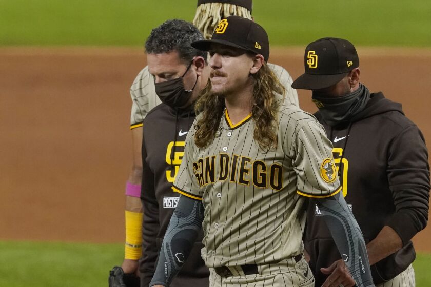 San Diego Padres starting pitcher Mike Clevinger leaves the game with an injury during the second inning.