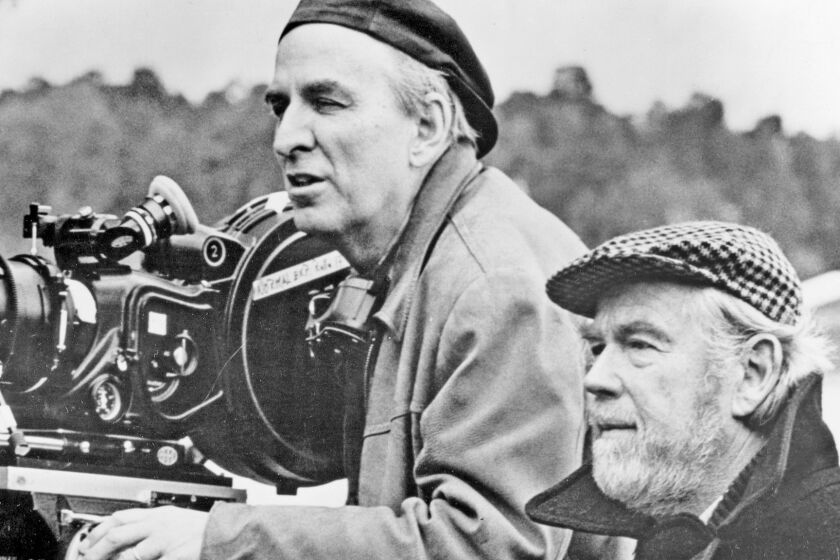 Ingmar Bergman, left, lines up a shot with cinematographer, Sven Nykvist, for the 1982 film "Fanny and Alexander."