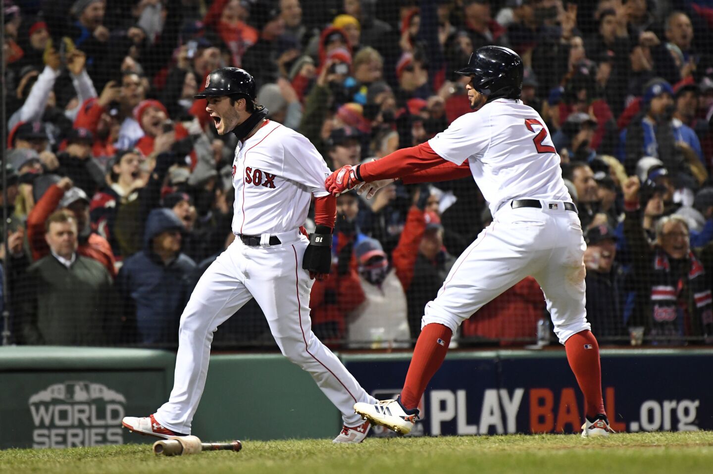 Red Sox Andrew Benintendi and Xander Bogaerts celebrate after Benintendi scored on a J.D. Martinez single in the fifth inning.