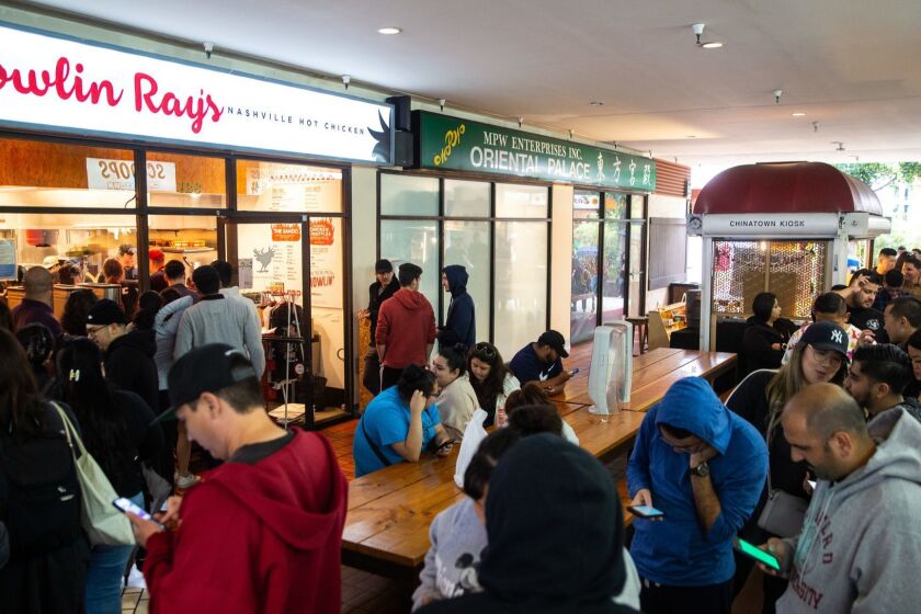LOS ANGELES, CALIF. - MAY 23: People wait in line for Nashville Hot Chicken from Howlin' Ray's at Far East Plaza in Chinatown on Thursday, May 23, 2019 in Los Angeles, Calif. (Kent Nishimura / Los Angeles Times)