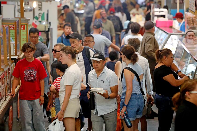 LOS ANGELES, CA - AUGUST 31: Lunch time crowd at Grand Central Market on Thursday, Aug. 31, 2023 in Los Angeles, CA. COVID-19 making a comeback in California. (Gary Coronado / Los Angeles Times)