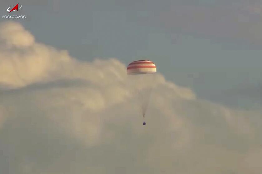 In this photo taken from video released by Roscosmos space corporation, a Russian Soyuz MS-23 space capsule descends about 150 km (90 miles) south-east of the Kazakh town of Zhezkazgan, Kazakhstan, Wednesday, Sept. 27, 2023. The Soyuz capsule carrying NASA astronaut Frank Rubio, Roscosmos cosmonauts Sergey Prokopyev, and Dmitri Petelin, touched down on Wednesday on the steppes of Kazakhstan. (Roscosmos space corporation via AP)