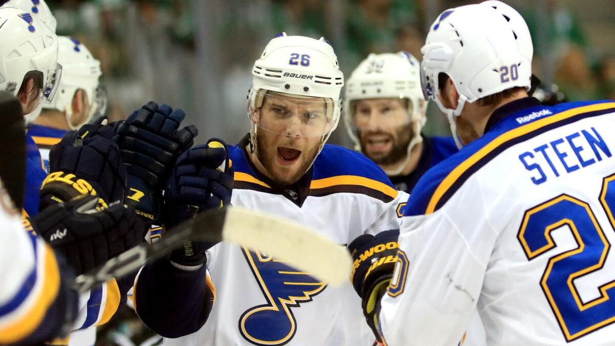 Blues teammates congratulate Paul Stastny after he scored a goal in the first period against the Stars in Game 7 on Wednesday night in Dallas.