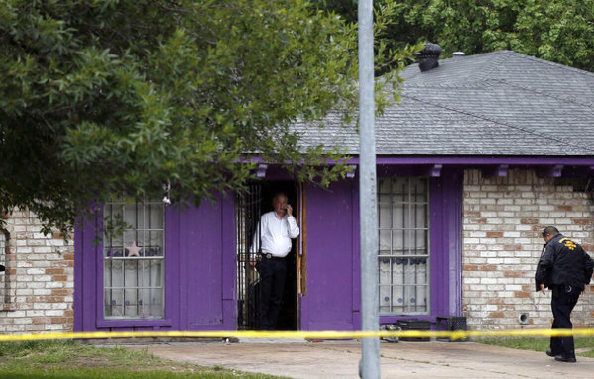 One of three men rescued this month after being held captive in a Houston garage has died. In this file photo, authorities investigate a house where, according to a 911 call, men were "being held against their will."