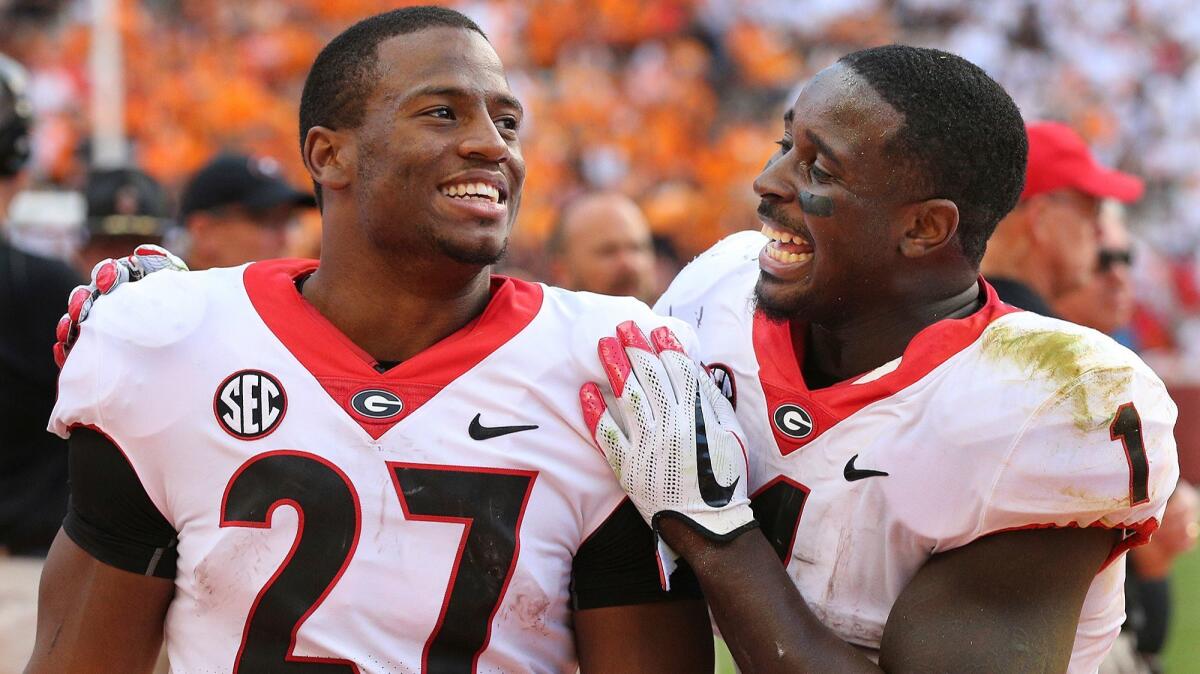 Georgia tailbacks Nick Chubb, left, and Sony Michel decided to return for their senior season. That decision helped catapult Georgia into the national championship game against Alabama.