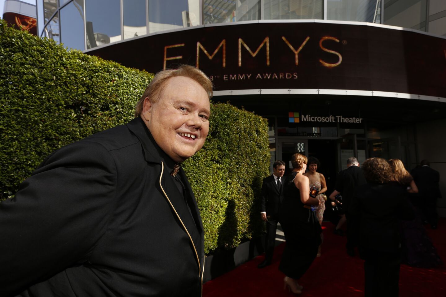 Louie Anderson gets ready to enter the Microsoft Theater.