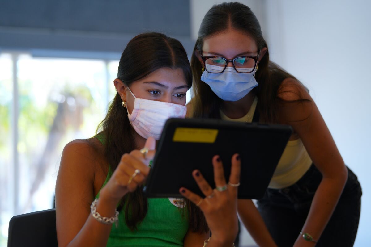 Natalia Castro (l) was vaccinated Thursday at Southwestern College. Her sister Celeste Castro (r) was vaccinated earlier.