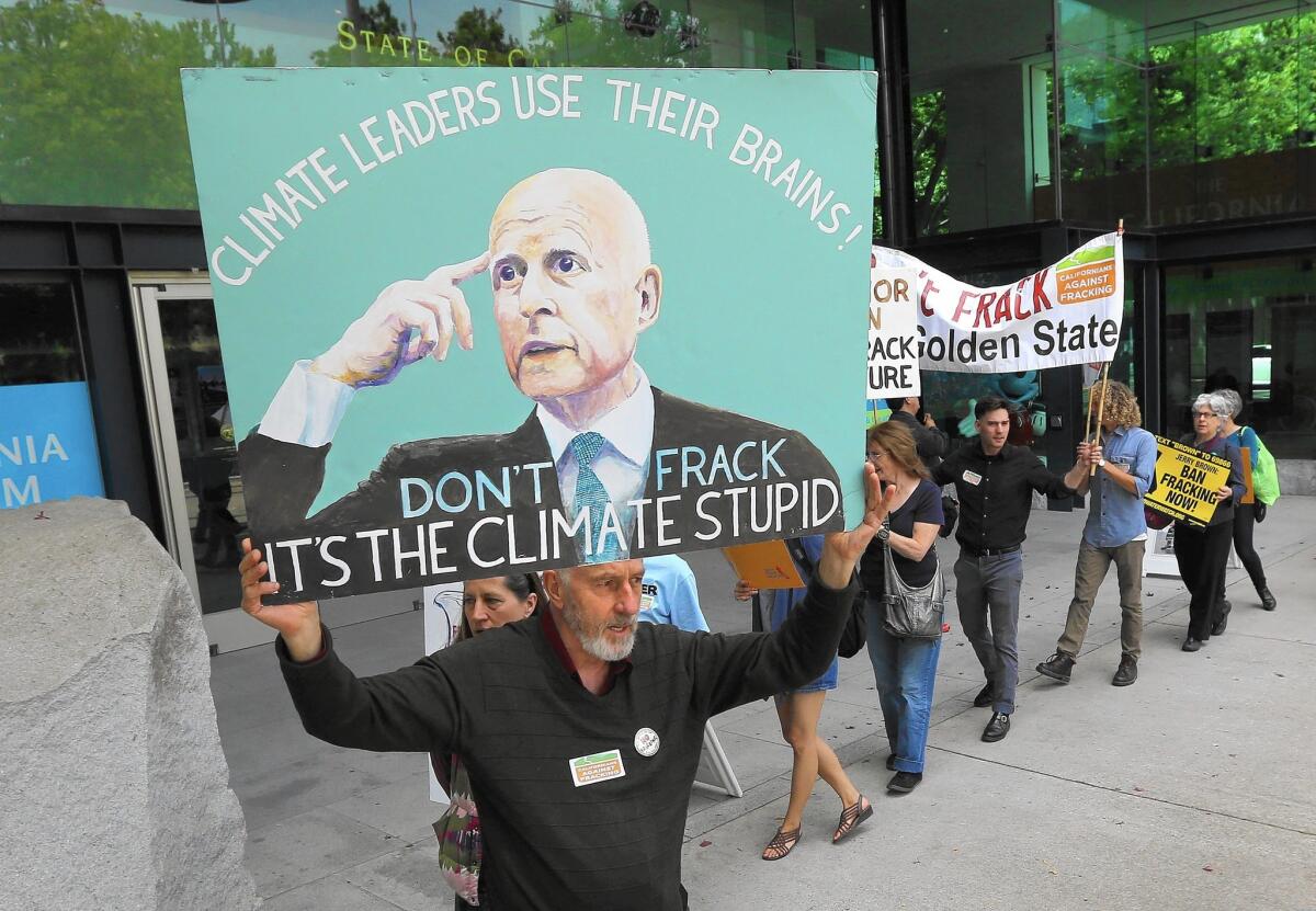 Protesters call on Gov. Jerry Brown to put a halt to hydraulic fracturing in California during a protest in Sacramento on April 29.