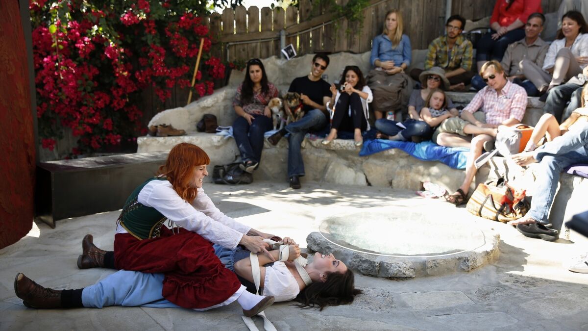 A production of "The Taming of the Shrew" features Keri Safran, left, as Kate, and Jennica Hill as Bianca.