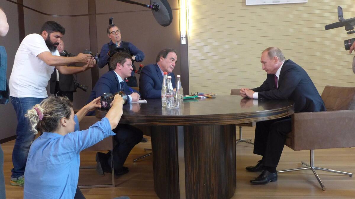 Pictured (seated): Interpreter Sergei Chudinov, Oliver Stone and Russian President Vladimir Putin in the Showtime documentary "The Putin Interviews." (Maximilien Arvelaiz / Komandir / Showtime)