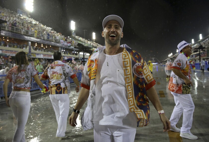 In this Feb. 15, 2015 photo, comedian and actor Paulo Gustavo participates in the Carnival parade at the Sambadrome in Rio de Janeiro, Brazil. The popular comedian died in a Rio hospital from complications related to COVID-19. He was 42. (AP Photo/Bruna Prado)