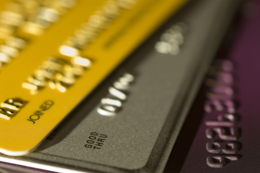 Close up of three credit cards with shallow depth of field