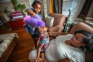 Detroit, MI - June 22: Morgan McFarland, 9, left, and her sister Rylee McFarland, age 3, middle, are enjoying playing around their mother Chiniestka McFarland, 38, right, in their living room after dinner on Thursday, June 22, 2023, in Detroit, MI. (Francine Orr / Los Angeles Times)