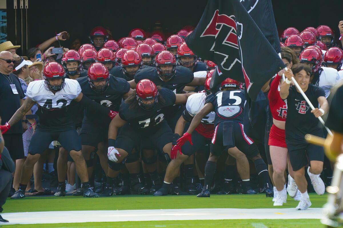 Aztecs take the field during the team’s scrimmage at the Snapdragon Stadium.