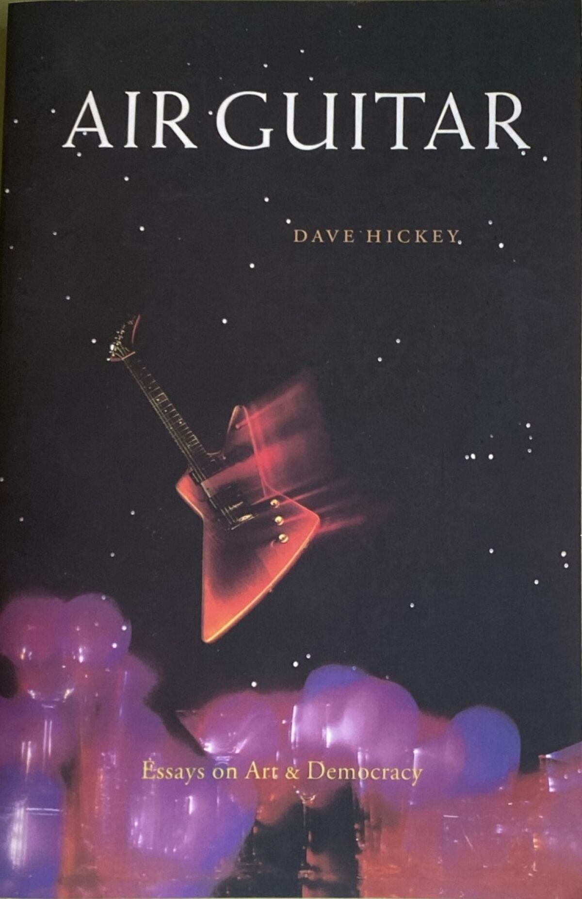 The cover of Dave Hickey's book "Air Guitar: Essays on Art & Democracy" shows a guitar floating in the night sky.