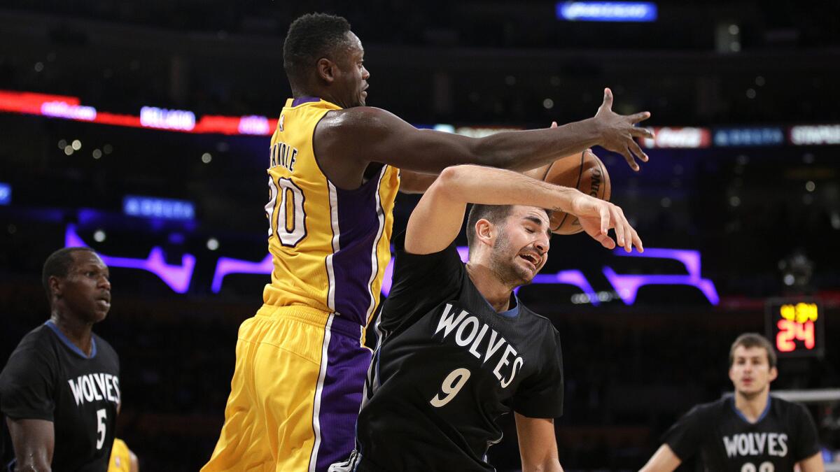 Lakers forward Julius Randle beats Timberwolves guard Ricky Rubio to a rebound in the second half Wednesday night.