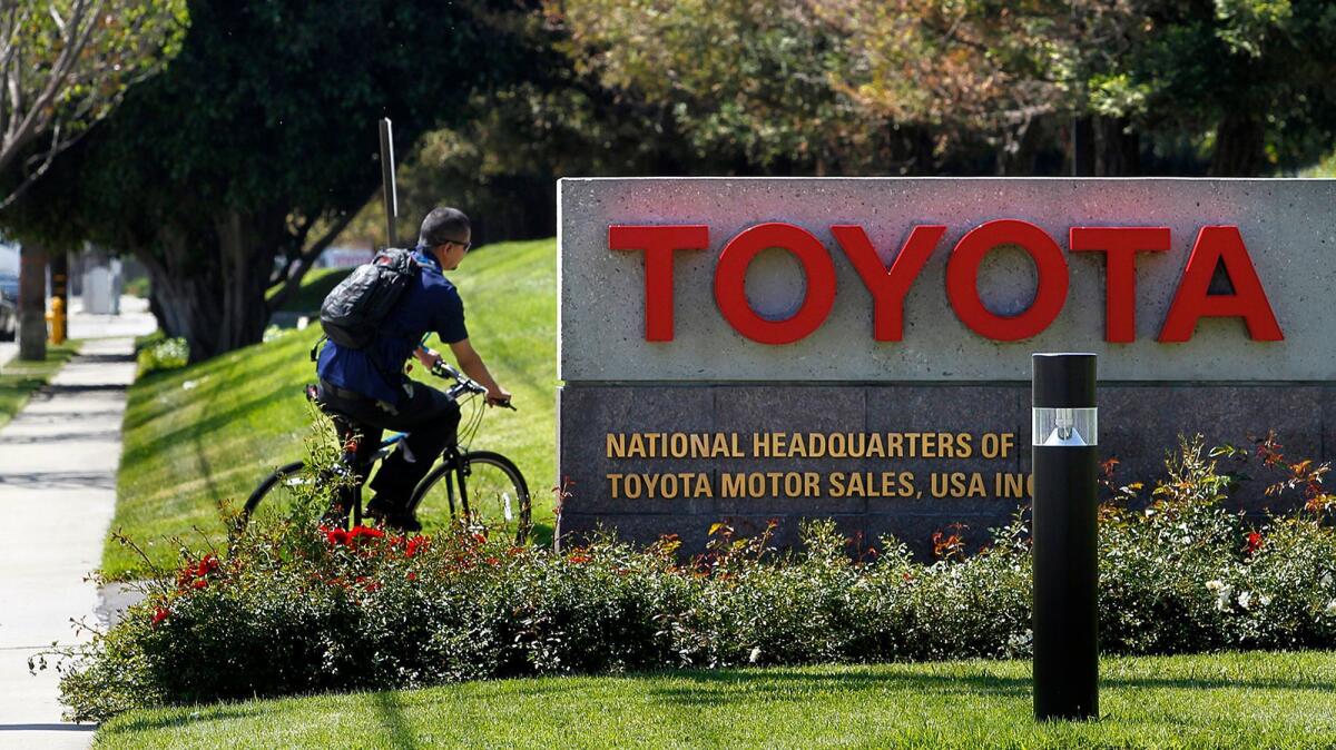 A bicyclist pulls into Toyota's U.S. Headquarters in Torrance in April 2014. Toyota will be completing the move of its U.S. headquarters to Plano, Texas this year and has put the 110-acre South Bay campus on the market.