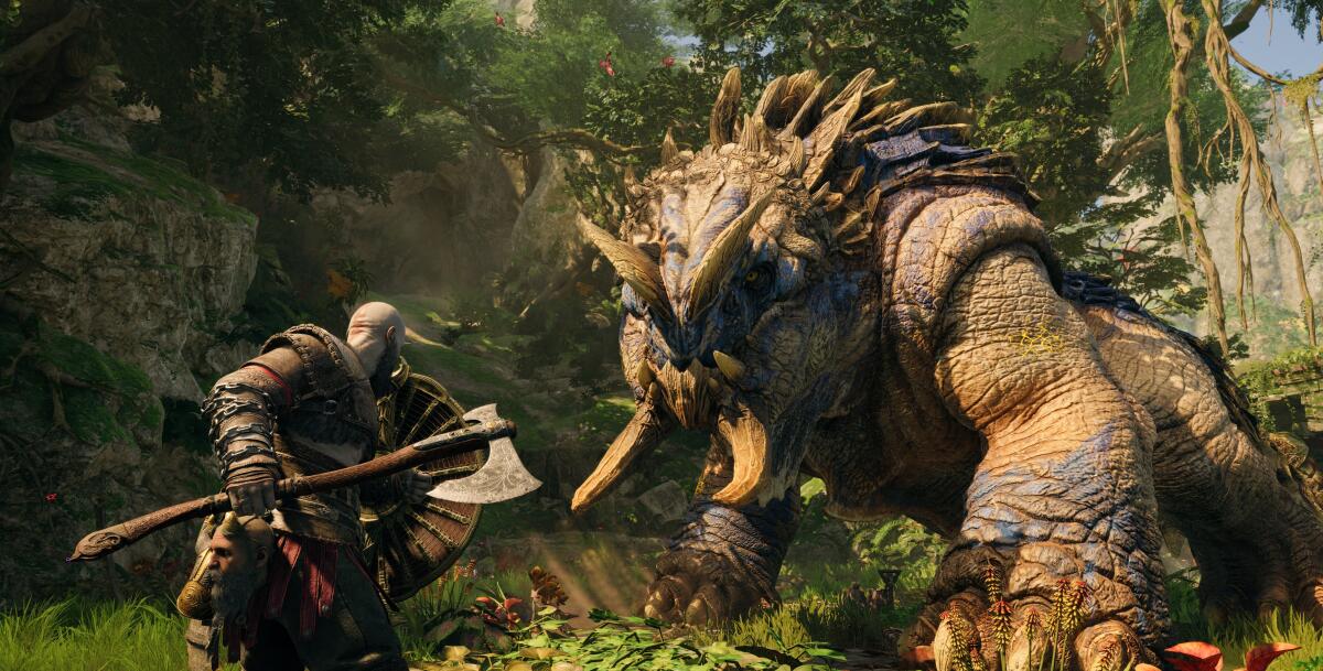 A man with an ax confronts a creature in the video game "God of War Ragnarok."
