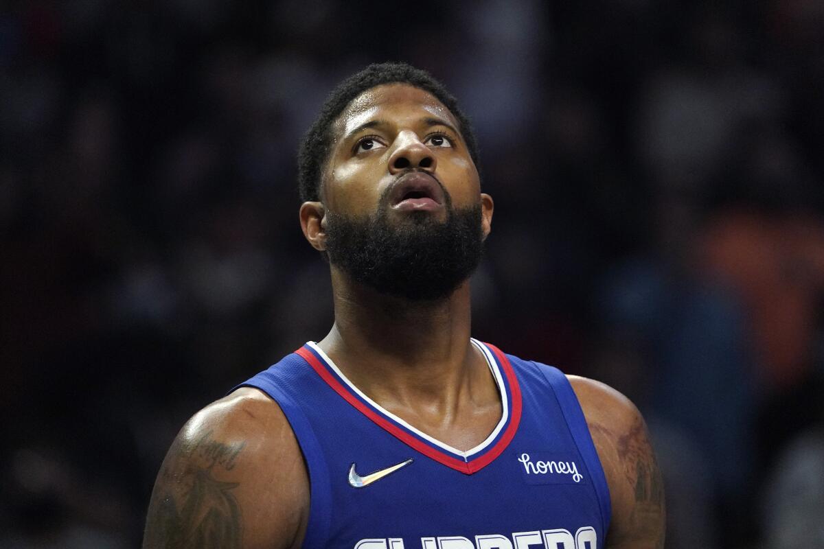 Clippers guard Paul George watches as a free throw is being shot on Tuesday