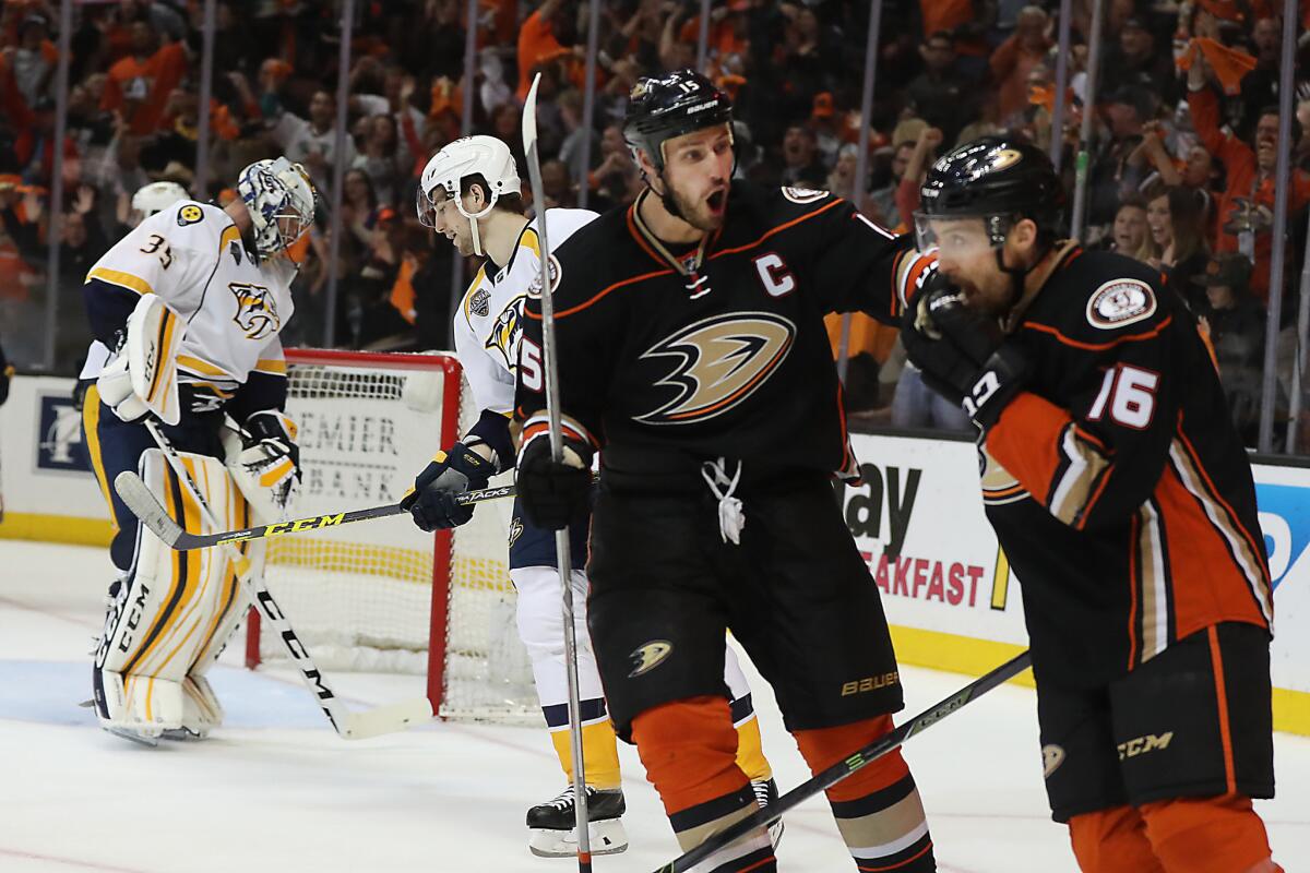 Ducks forward Ryan Getzlaf celebrates with teammate Ryan Garbutt after a David Perron goal over the head of Predators goalie Pekke Rinne during second period of a game on April 23.