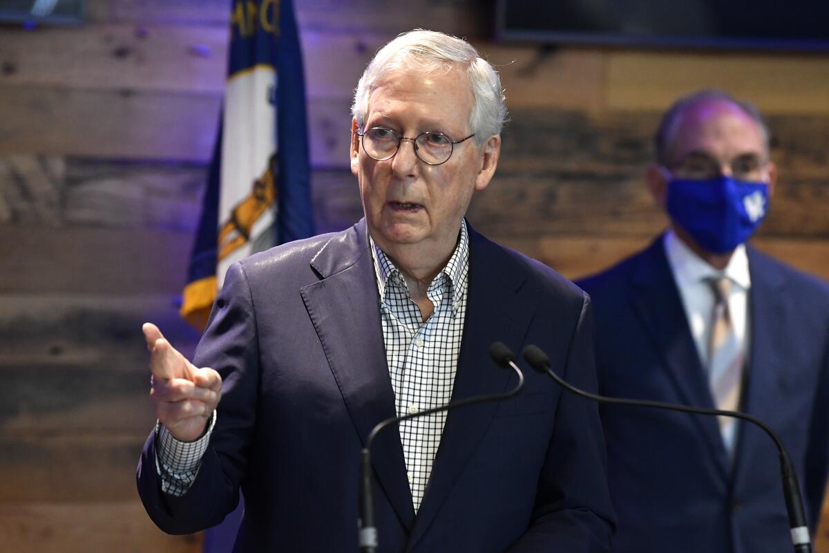Senate Minority Leader Mitch McConnell, R-Ky., listens to a reporters question during a press conference at a COVID vaccination site in Lexington, Ky., Monday, April 5, 2021. (AP Photo/Timothy D. Easley)